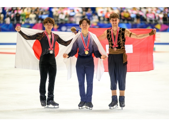 Silver medallist Japan's Shun Sato, gold medallist Japan's Yuma Kagiyama and bronze medallist Switzerland's Lukas Britschgi pose in the medal ceremony for the men's single during the NHK Trophy figure skating competition in Kadoma City. Photo by Philip Fong / AFP