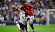 Tottenham Hotspur's Portugese midfielder #06 Joao Palhinha (L) vies with Manchester United's Portuguese midfielder #08 Bruno Fernandes (R) during the English Premier League football match between Tottenham Hotspur and Manchester United at the Tottenham Hotspur Stadium in London, on November 8, 2025. (Photo by Ben STANSALL / AFP)