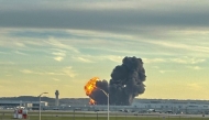 This handout photo courtesy of Levi Dean shows smoke and flames rising from the site of a UPS cargo plane crash outside Louisville International Airport in Louisville, Kentucky, on November 4, 2025. Photo by HANDOUT / Courtesy of X account @LeviDean98 / AFP