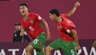 Morocco's Ilyas Hidaoui (left) celebrates with teammate Bilal Soukrat after scoring his team's sixth goal. Pic: X/@EnMaroc