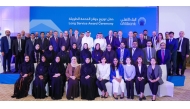 Ahlibank officials with its long-serving employees at the award ceremony.