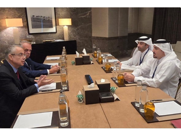 CEO of the Qatar Financial Markets Authority, Dr. Tamy bin Ahmad Al Binali, along with other officials.