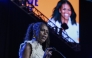 Former first lady Michelle Obama addresses the crowd at the When We All Vote Rally outside Atlanta, a campaign appearance stumping for Vice President Kamala Harris last year. Jahi Chikwendiu/The Washington Post