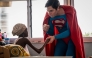 Leonardo Muylaert, known as the Brazilian Superman, greets a patient during a visit at the Korle Bu Teaching Hospital in Accra. (Photo by Claudia Lacave / AFP)