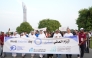 Representatives and participants walking around Aspire park to mark World Diabetes Day.