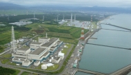 This photo taken on July 16, 2007 shows an aerial view of Tokyo Electric Power Company Kashiwazaki-Kariwa Nuclear Power Plant in Kashiwazaki City, Niigata Prefecture. (Photo by JIJI Press / AFP)