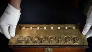(Files) This photograph shows La Pascaline, first mechanical calculating machine invented by French polymathe Blaise Pascal displayed at the Christie's auction house in Paris, on September 11, 2025. (Photo by Stephane De Sakutin / AFP)