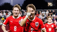 Austria's Hasan Deshishku (right) celebrates after scoring a goal. PIC: OEFB