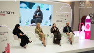 Experts exchanging ideas during a panel discussion at the Smart City Expo Doha 2025. 