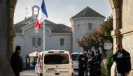 A Gendarmerie car drives past the entrance of the jail of Dijon, eastern France on November 27, 2025. (Photo by Arnaud Finistre / AFP)