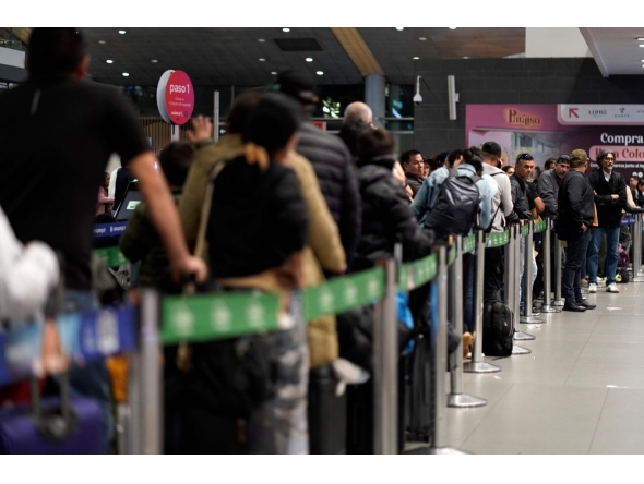 Passengers are pictured at El Dorado airport in Bogota on November 28, 2025. Colombian airline Avianca reported on Friday 