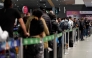 Passengers are pictured at El Dorado airport in Bogota on November 28, 2025. Colombian airline Avianca reported on Friday 