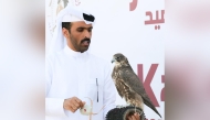 Participant with his falcon during the competition.