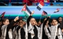 Children wave Arab flags during the event marking International Day of Solidarity with the Palestinian People.