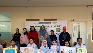 Officials with students during the event.