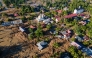 An aerial view shows flood damage in Meureudu, Pidie Jaya district in Indonesia's Aceh province on November 30, 2025. (Photo by CHAIDEER MAHYUDDIN / AFP)
