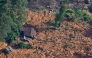 An aerial view shows a residential house lying in a shattered state at the site of a landslide in Nuwara Eliya on December 2, 2025. Photo by ISHARA S. KODIKARA / AFP