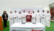 QFA and Snoonu officials during the signing ceremony.