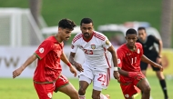 Action during the match between UAE and Oman.