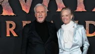 US director James Cameron and his spouse US former actress and model Suzy Amis Cameron pose during a photocall for the European premiere of 