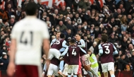 Aston Villa's Argentinian midfielder #10 Emiliano Buendia is mobbed by teammates after scoring the team's second goal during the English Premier League football match between Aston Villa and Arsenal at Villa Park in Birmingham, central England on December 6, 2025. (Photo by JUSTIN TALLIS / AFP)
