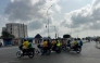Motorbike taxis carrying passengers stops at a crossroad in Cotonou following rumors of a possible coup in the country on December 7, 2025. (Photo by AFP)
 