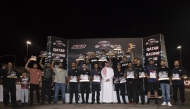 QRC Director General Sheikh Jabor bin Khalid Al Thani poses for a photo with the podium winners.