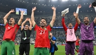 Morocco players celebrate their win over Saudi Arabia yesterday. 