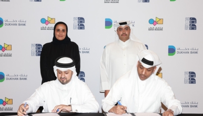 Qatar Museums Chairperson H E Sheikha Al Mayassa bint Hamad bin Khalifa Al Thani, Dukhan Bank Executive Board Member and Managing Director H E Sheikh Mohammed bin Hamad bin Jassim Al-Thani, and other officials at the signing ceremony. 
