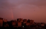 A general view of a rainbow at sunset following several days of rain in the Iranian capital Tehran on December 10, 2025. (Photo by Atta Kenare / AFP)