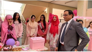 PISQ Principal Ch Muhammad Afzal along with staff and students during the event. 