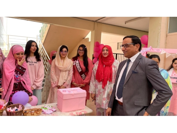 PISQ Principal Ch Muhammad Afzal along with staff and students during the event. 