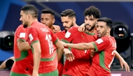 Morocco's Walid Azaro celebrates with teammates.