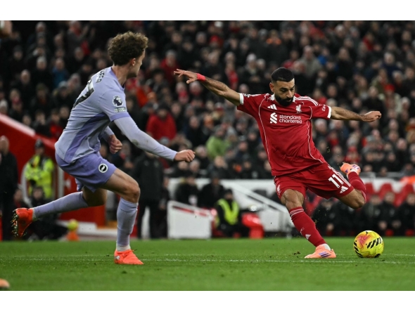 Liverpool’s Mohamed Salah attempts to shoot and score against Brighton and Hove Albion at Anfield yesterday.
