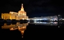 The Abdullah Bin Zaid al-Mahmoud Islamic Cultural Centre is reflected in a pool of water on a rainy day in the Qatari capital Doha on December 16, 2025. Photo by Mahmud HAMS / AFP