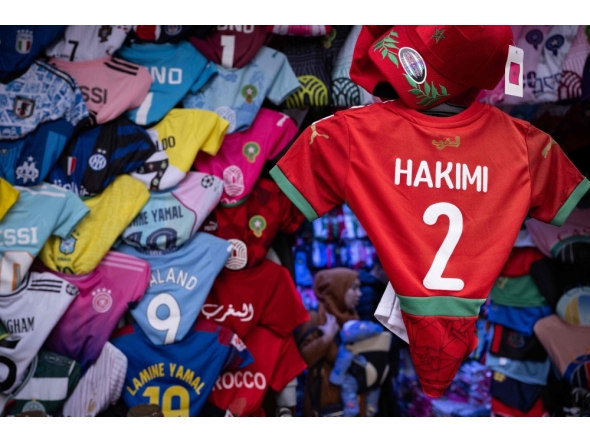 Morocco defender Achraf Hakimi's jersey is displayed in a shop in Rabat, on December 19, 2025, ahead of the Africa Cup of Nations (AFCON). (Photo by Sebastien Bozon / AFP)