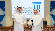 UDST President Dr. Salem Al-Naemi honouring Editor-in-Chief of The Peninsula Prof. Khalid Mubarak Al-Shafi at a ceremony held recently.