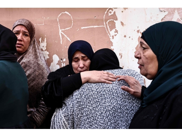 Women grieve during the funeral of Ahmad Zyoud in the village of Silat al-Harithiya, close to the northern West Bank city of Jenin on December 21, 2025. Photo by Zain JAAFAR / AFP