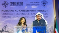 This handout picture released by the Kuwaiti news agency KUNA shows Kuwait's Prime Minister HH Sheikh Ahmad Abdullah al-Ahmad al-Sabah (R) and Kuwaiti minister of public works Nora al-Mashaan attending the contract signing ceremony between Kuwait and the China State Construction and Communications Corporation Limited on December 22, 2025. (Photo by KUNA / AFP) 