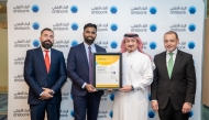 Ahlibank official receiving the ISO certification.