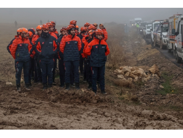 Rescuers work as search and rescue operations continue at the wreckage site following the crash of a Libya-bound business jet carrying Libyan Chief of Staff General Muhammad Ali Ahmed Al-Haddad, found 2 kilometers south of Kesikkavak Village at Haymana district in Ankara on December 24, 2025. (Photo by Adem Altan / AFP)
