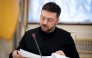 This handout photograph taken on December 23, 2025 and released by the Ukrainian Presidential Office on December 24, 2025 shows Ukraine's President Volodymyr Zelensky during a meeting with journalists in Kyiv. (Photo by Handout / Ukrainian Presidential Office / AFP)