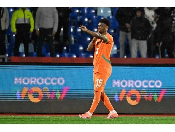 Ivory Coast's forward #15 Amad Diallo celebrates scoring the team's first goal during the Africa Cup of Nations (CAN) Group F football match between Ivory Coast and Mozambique at Marrakesh Stadium in Marrakesh on December 24, 2025. (Photo by Khaled Desouki / AFP)