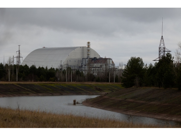 This photograph shows the containment vessel of the New Safe Confinement (NSC) which contains radiation from the remains of reactor 4 of the former Chernobyl Nuclear Power Plant, in Chernobyl, on December 22, 2025, amid the Russian invasion of Ukraine. Photo by Tetiana Dzhafarova / AFP
