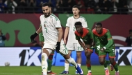 Algeria’s Riyad Mahrez shoots from the penalty spot.