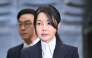 South Korea's former first lady Kim Keon Hee, wife of impeached former president Yoon Suk Yeol, arrives at a court to attend a hearing to review her arrest warrant requested by special prosecutors at the Seoul Central District Court in Seoul on August 12, 2025. (Photo by Jung Yeon-Je / Pool / AFP)