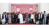 Members of Bazm-e-Urdu Qatar along with the poets during the event. 