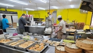 Staff work at a breakfast shop in Taipei, southeast China’s Taiwan.