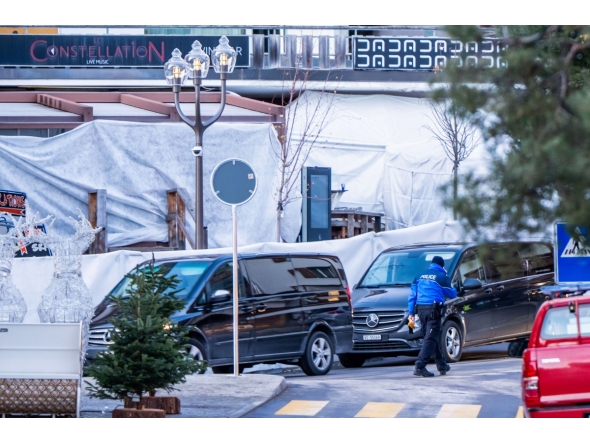 Funeral service vehicles arrive near the bar Le Constellation where a fire ripped through the venue during New Year's Eve celebrations in Crans-Montana, on January 1, 2026. Photo by MAXIME SCHMID / AFP
