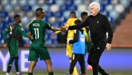 South Africa's head coach Hugo Broos shaks hands with South Africa's midfielder #11 Mohau Nkota after the Africa Cup of Nations (CAN) Group B football match between Zimbabwe and South Africa at Marrakesh Stadium in Marrakesh on December 29, 2025. (Photo by Khaled Desouki / AFP)
